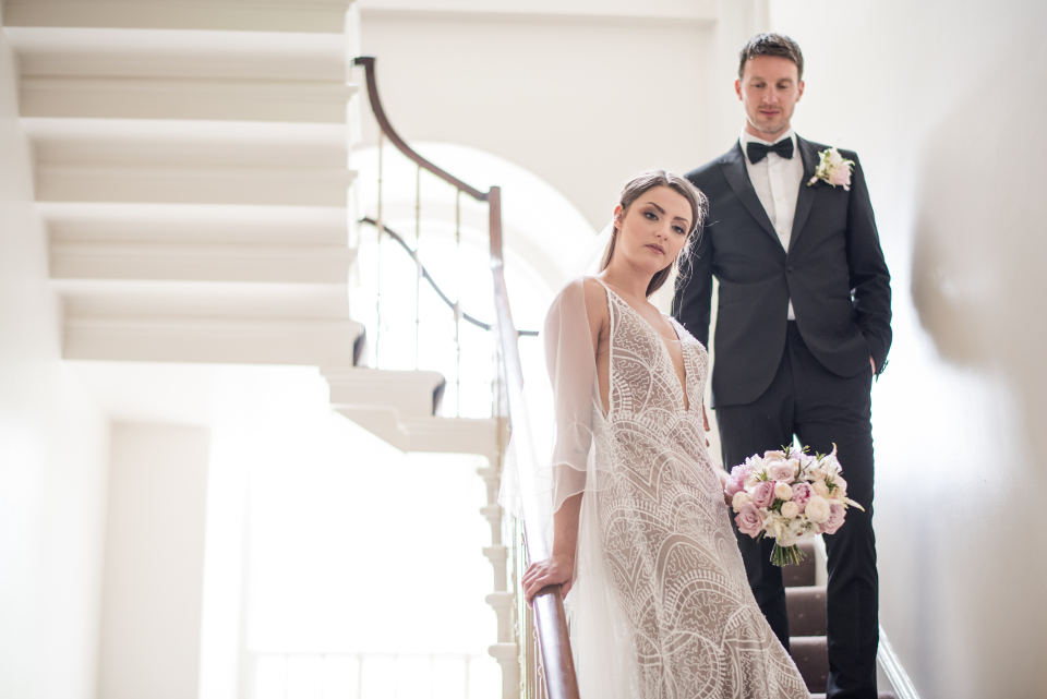 Bride and groom on staircase